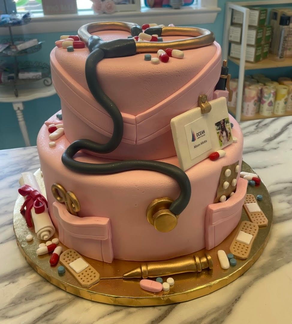 A cake with a graduation cap and tassel on top of it