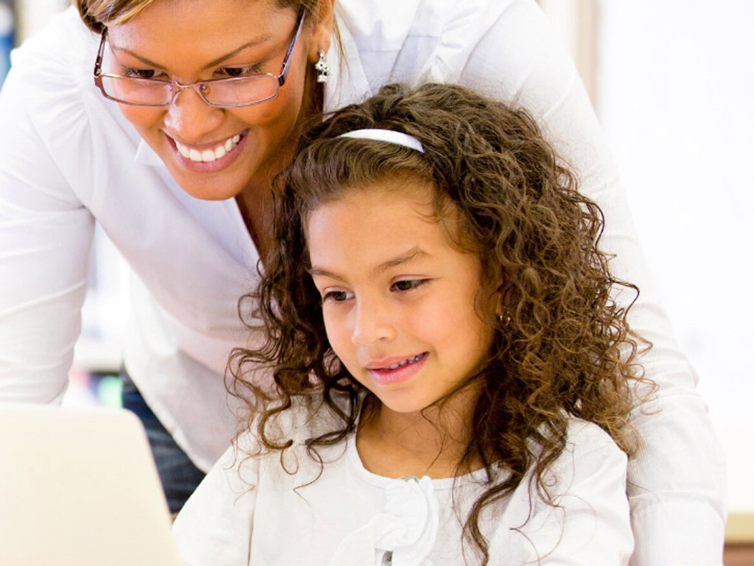 teacher and girl reading