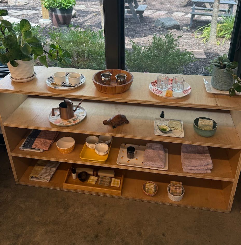 A primary classroom prepared practical life shelf. 