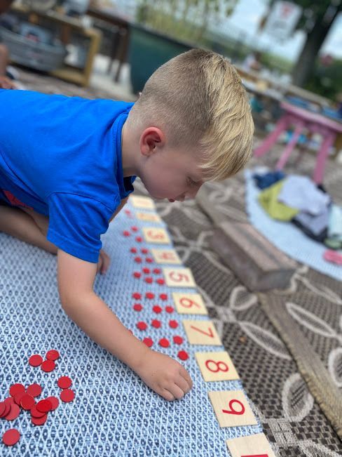 An IMA student counts with the Cards and Counters.