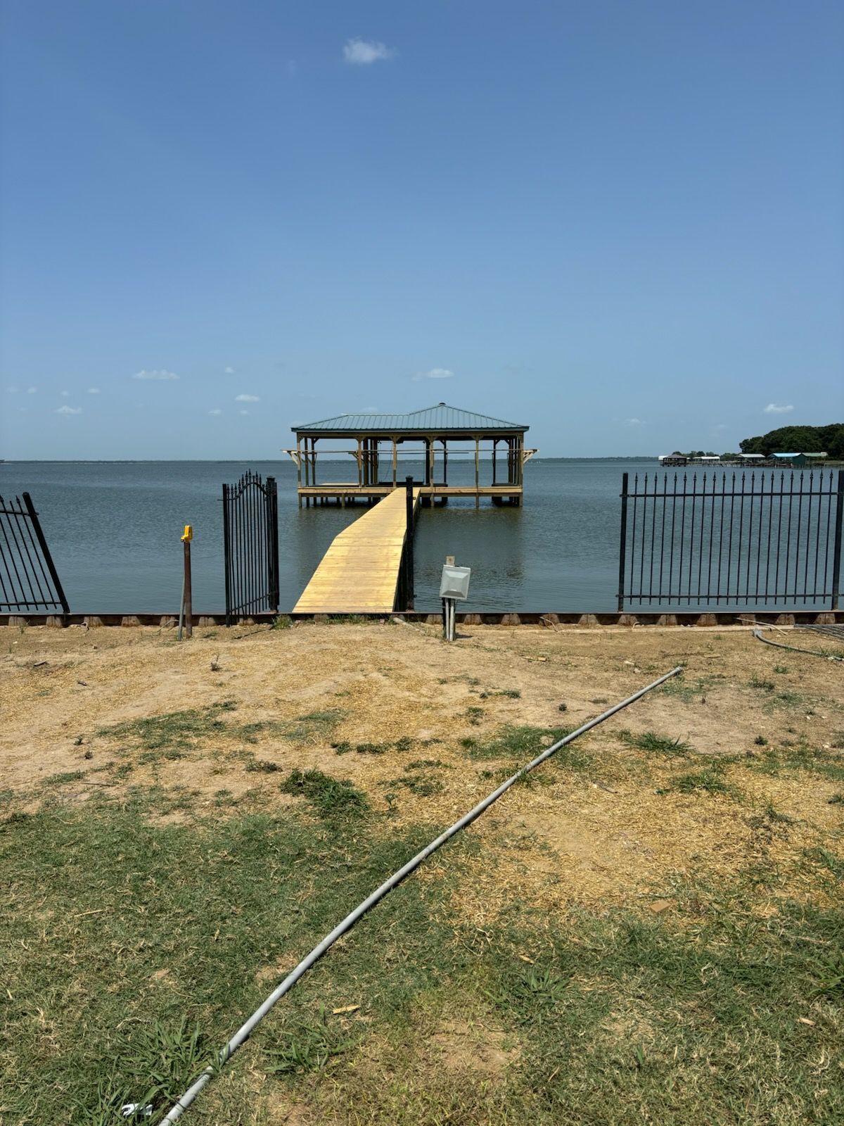 There is a dock in the middle of the ocean.