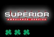 The logo for superior ambulance service with three shamrocks in the background.