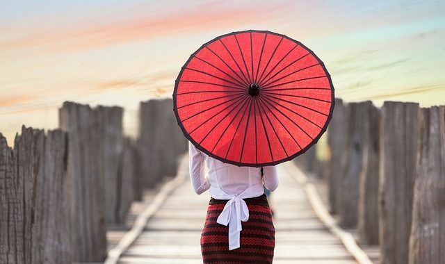 A Lady Is Walking Across A Wooden Bridge - Columbia, SC - Custom Assurance Placements