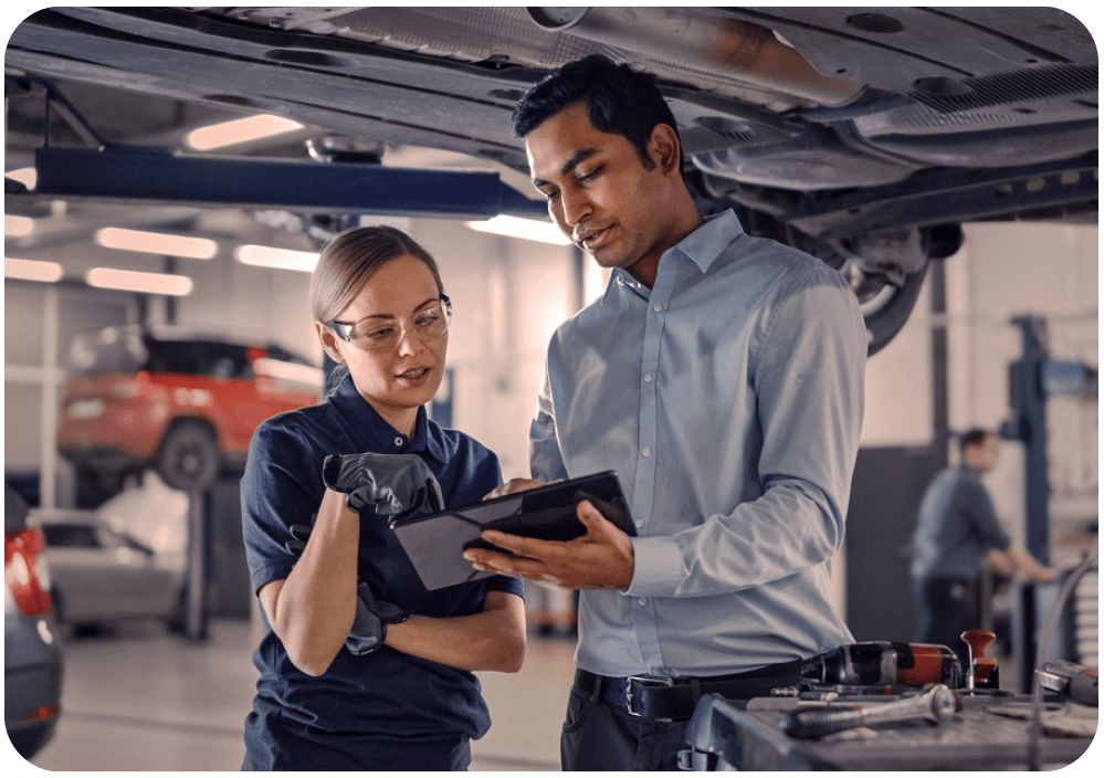 Mechanics reviewing payments on tablet device