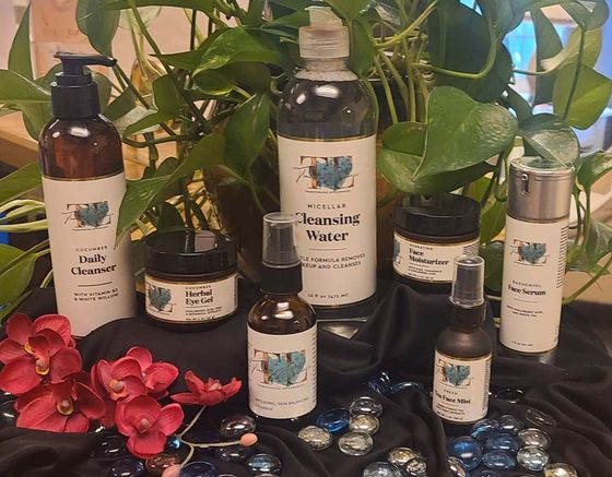 A group of bottles sitting on top of each other on a table.
