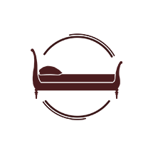 Stylized brown bed icon inside a circular border