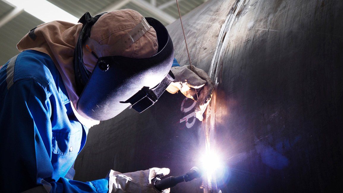 Man Welding — Coatings in Burdekin Shire, QLD