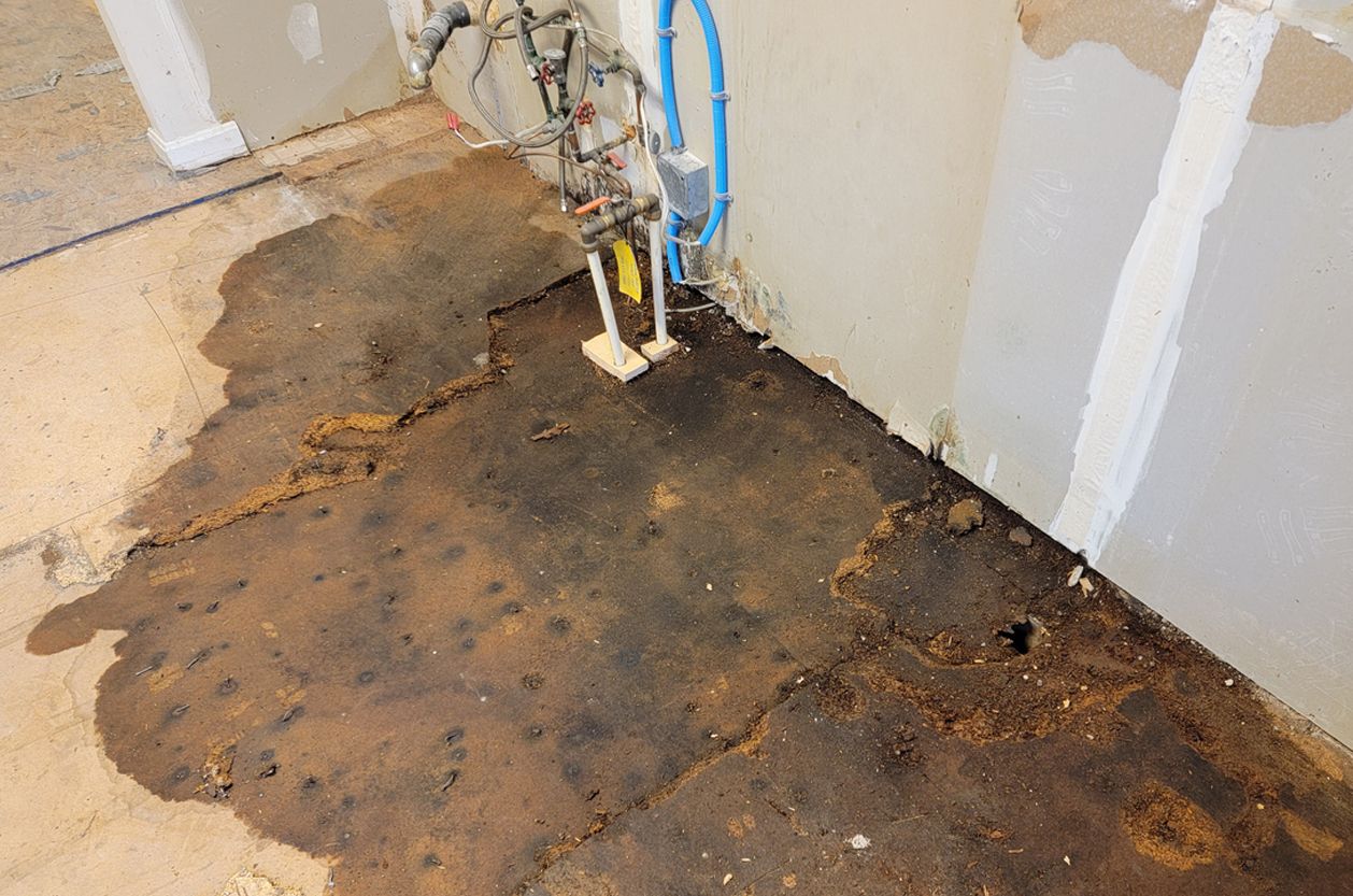 a basement floor with a lot of water coming out of it