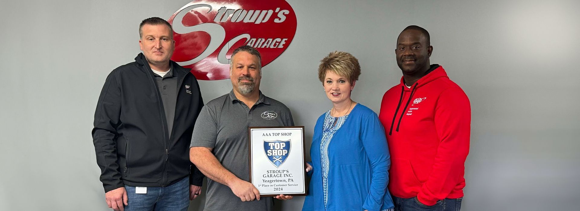 Our Team With an Award from AAA - Stroup's Garage