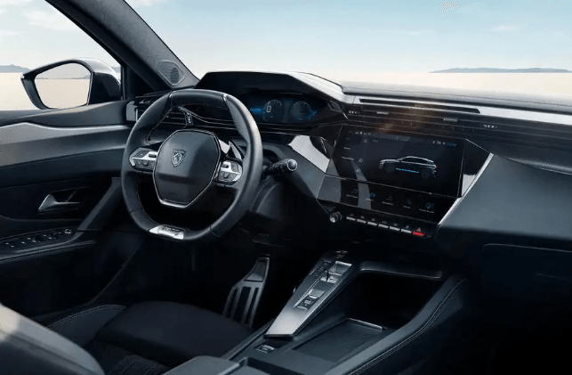The interior of a car with a steering wheel and dashboard.
