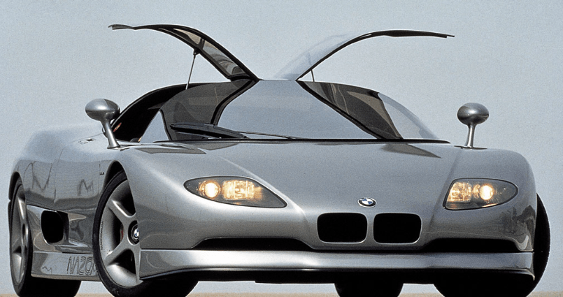A silver bmw sports car with its hood open