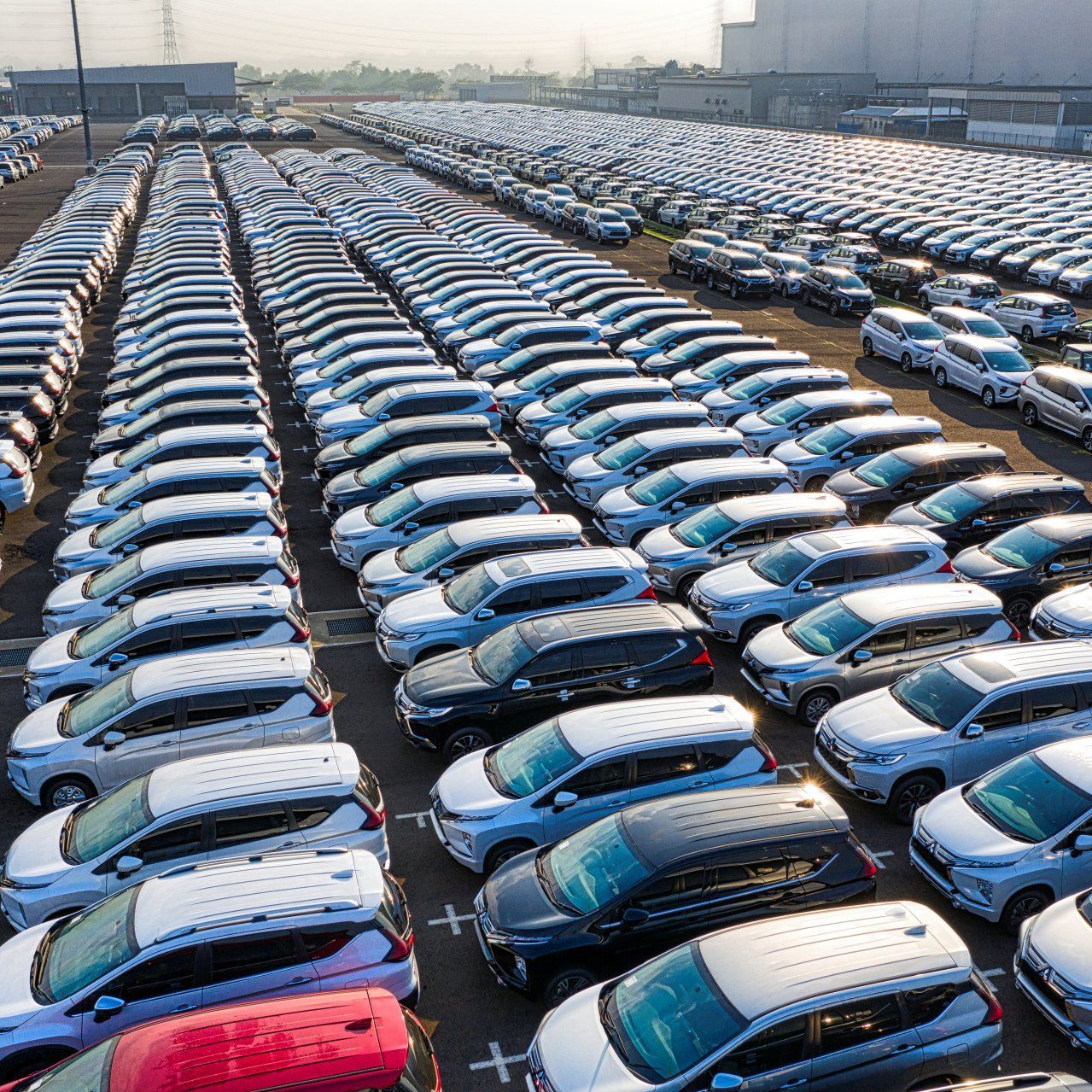 A lot of cars are parked in a parking lot