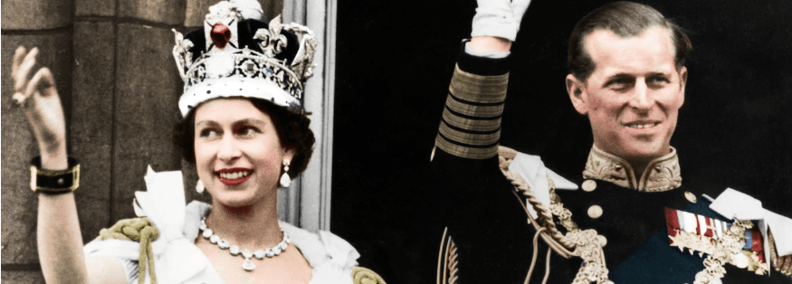 A man and a woman are standing next to each other and the woman is wearing a crown.