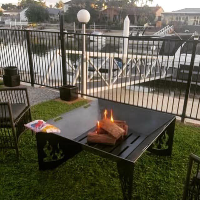 Metal Chairs and Table with Metal Fence — Steel Fabrication in Molendinar, QLD