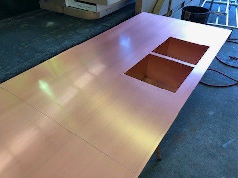Copper countertop with two sink cutouts.