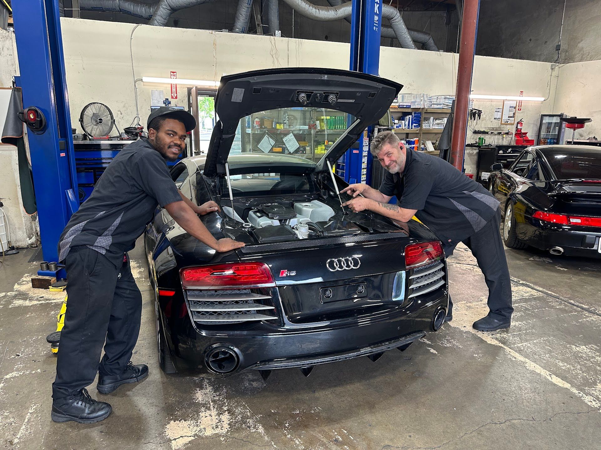 Technicians Servicing A Black Audi R8 Engine | German Autowerke