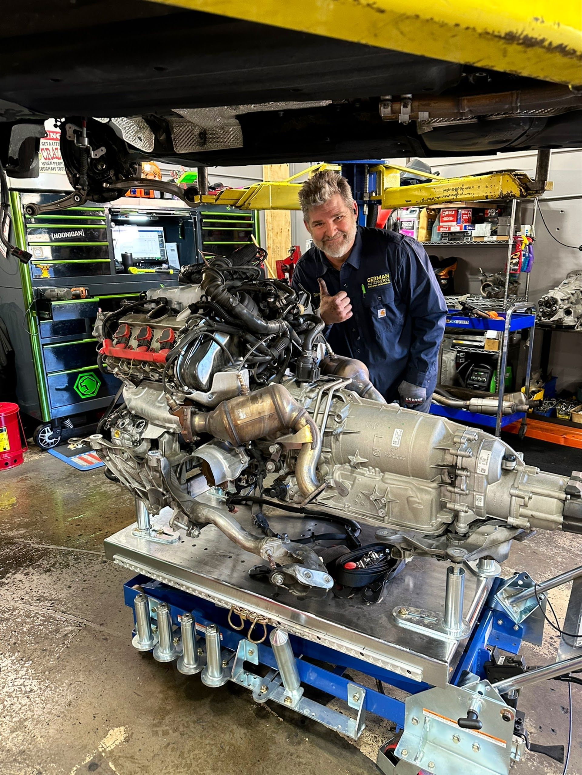 Technician Working On A Removed German Engine Assembly | German Autowerke