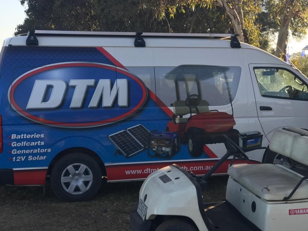 A Dtm Van Is Parked Next to A Golf Cart — DTM Tamworth in Tamworth, NSW