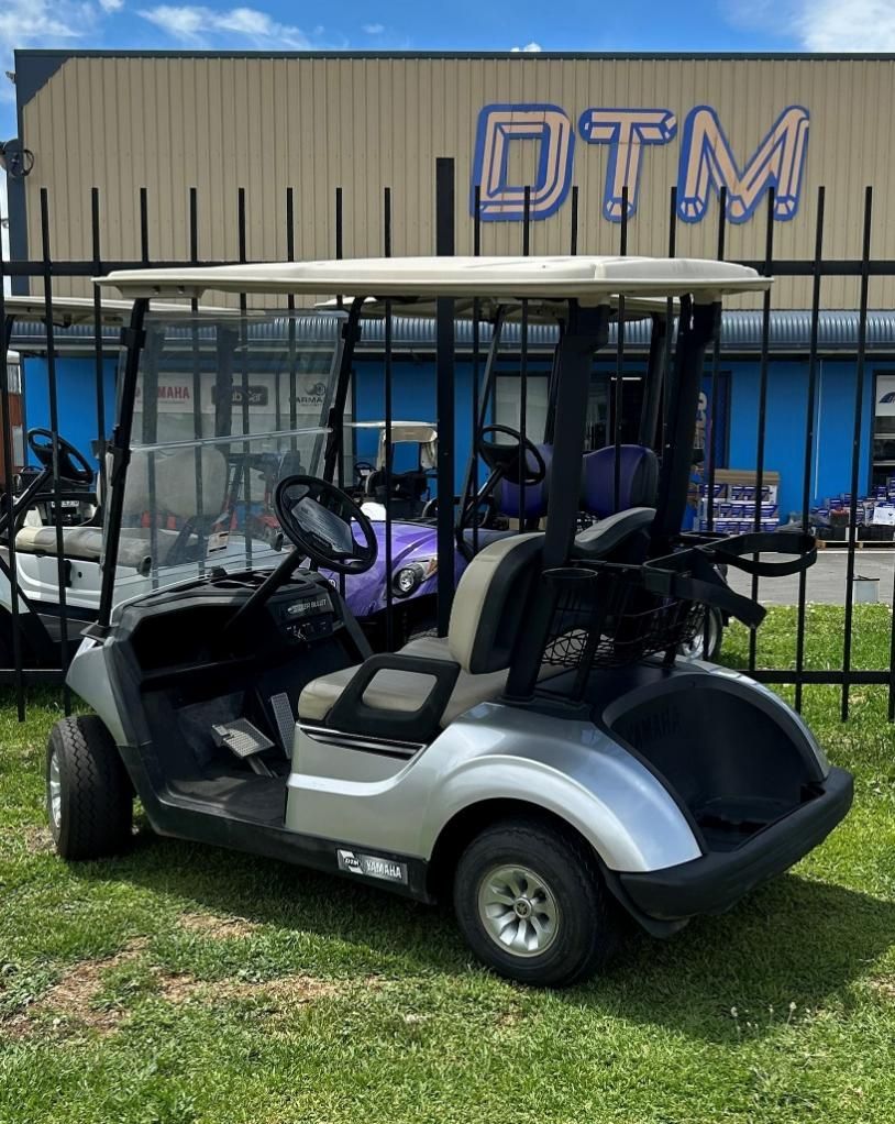 A Golf Cart Is Parked in Front of A Building that Says Dtm — DTM Tamworth in Narrabri, NSW