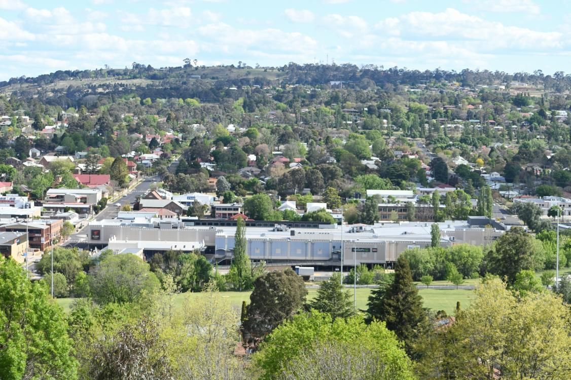 An Aerial View of A Small Town Surrounded by Trees and Buildings — DTM Tamworth in Armidale, NSW
