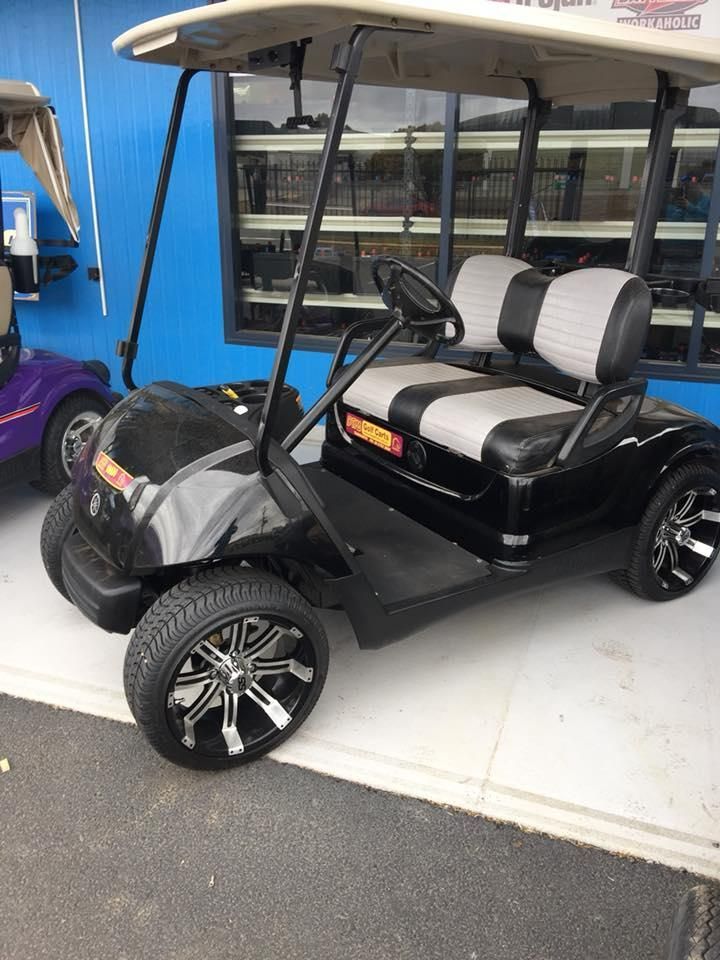 A Black and Gray Golf Cart Is Parked in Front of A Building — DTM Tamworth in Armidale, NSW
