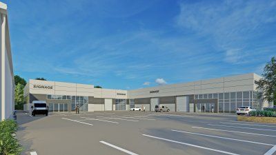 An artist 's impression of a large Reidsteel building with a parking lot in front of it.
