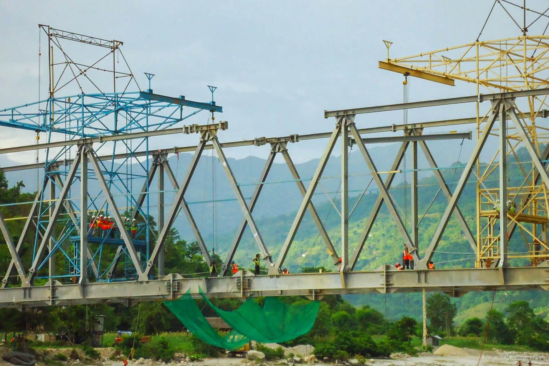 A bridge is being built over a river.