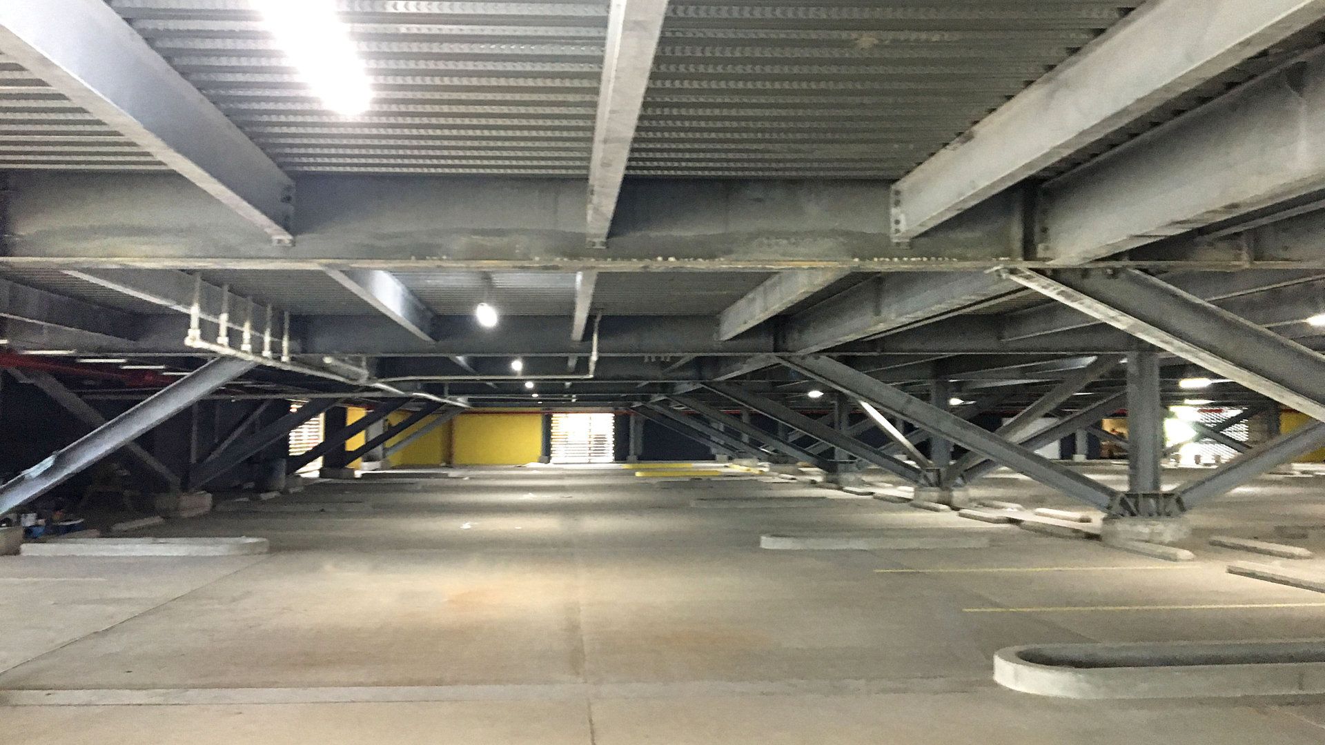 Looking up at the ceiling of a parking garage.