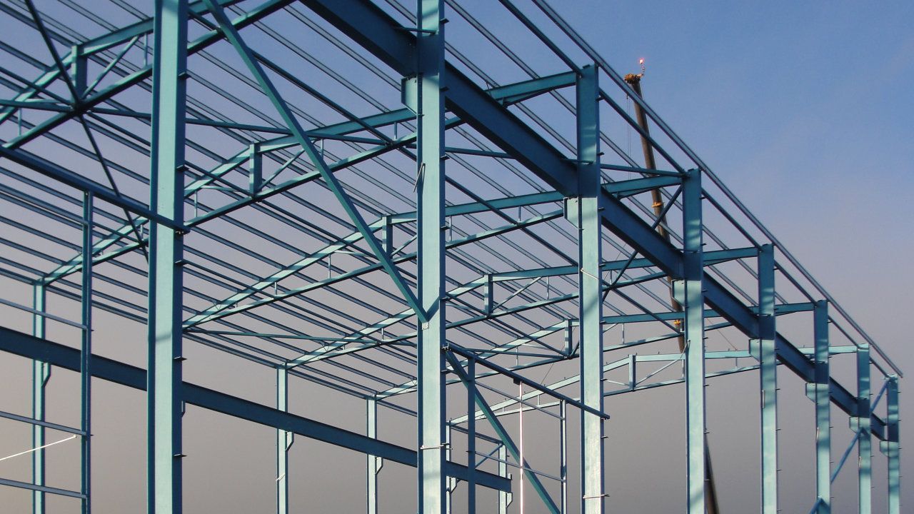 A large metal structure with a blue sky in the background