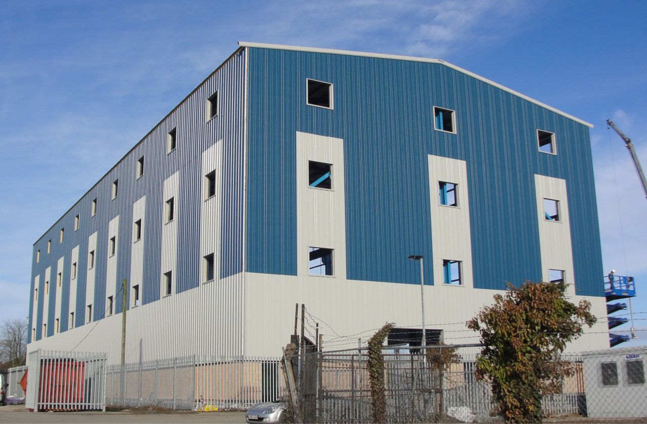 A large blue and white building with a lot of windows
