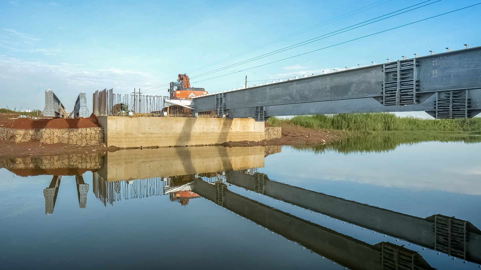 A bridge is being built over a body of water.