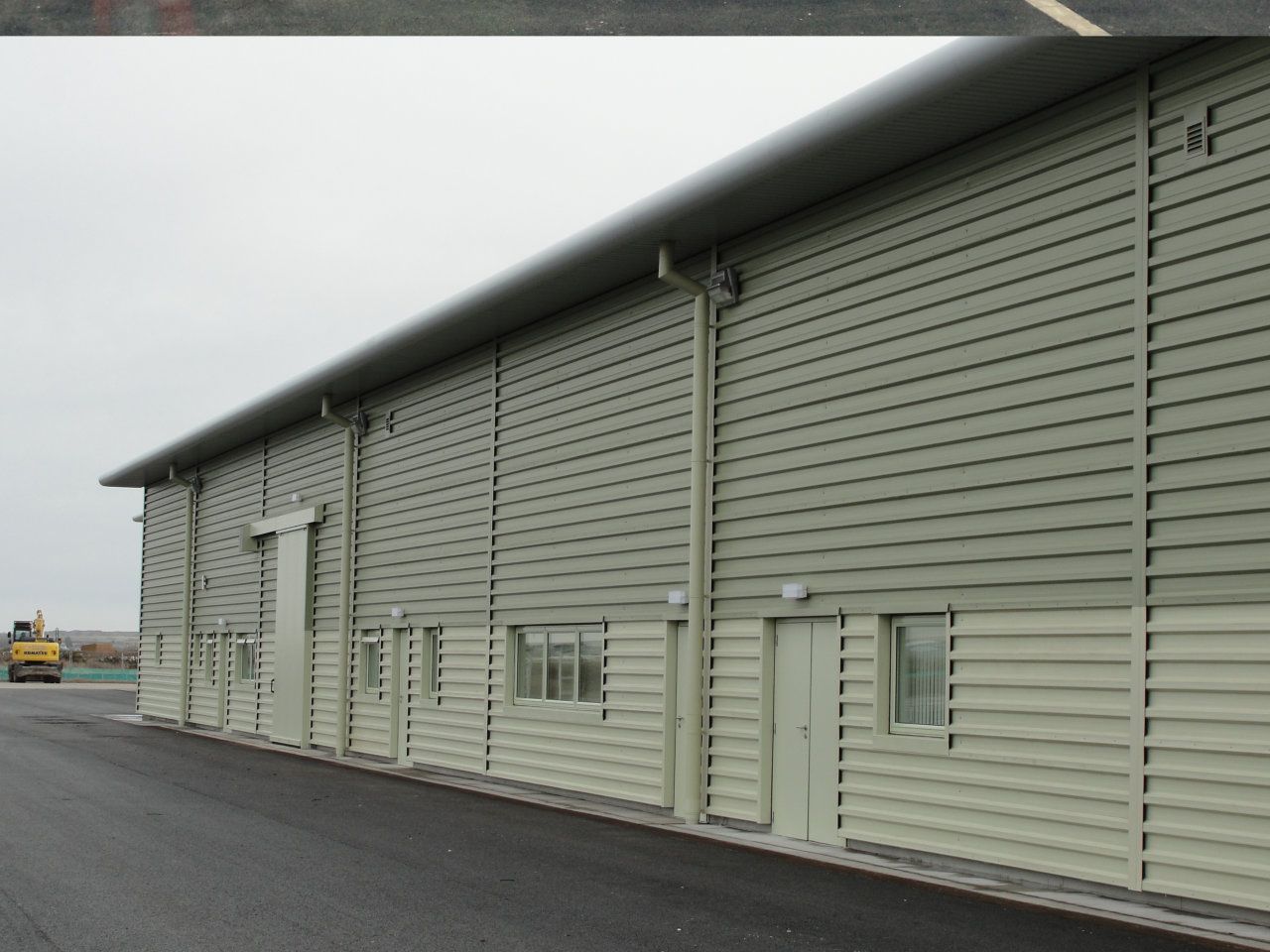 A large building with a lot of windows and doors