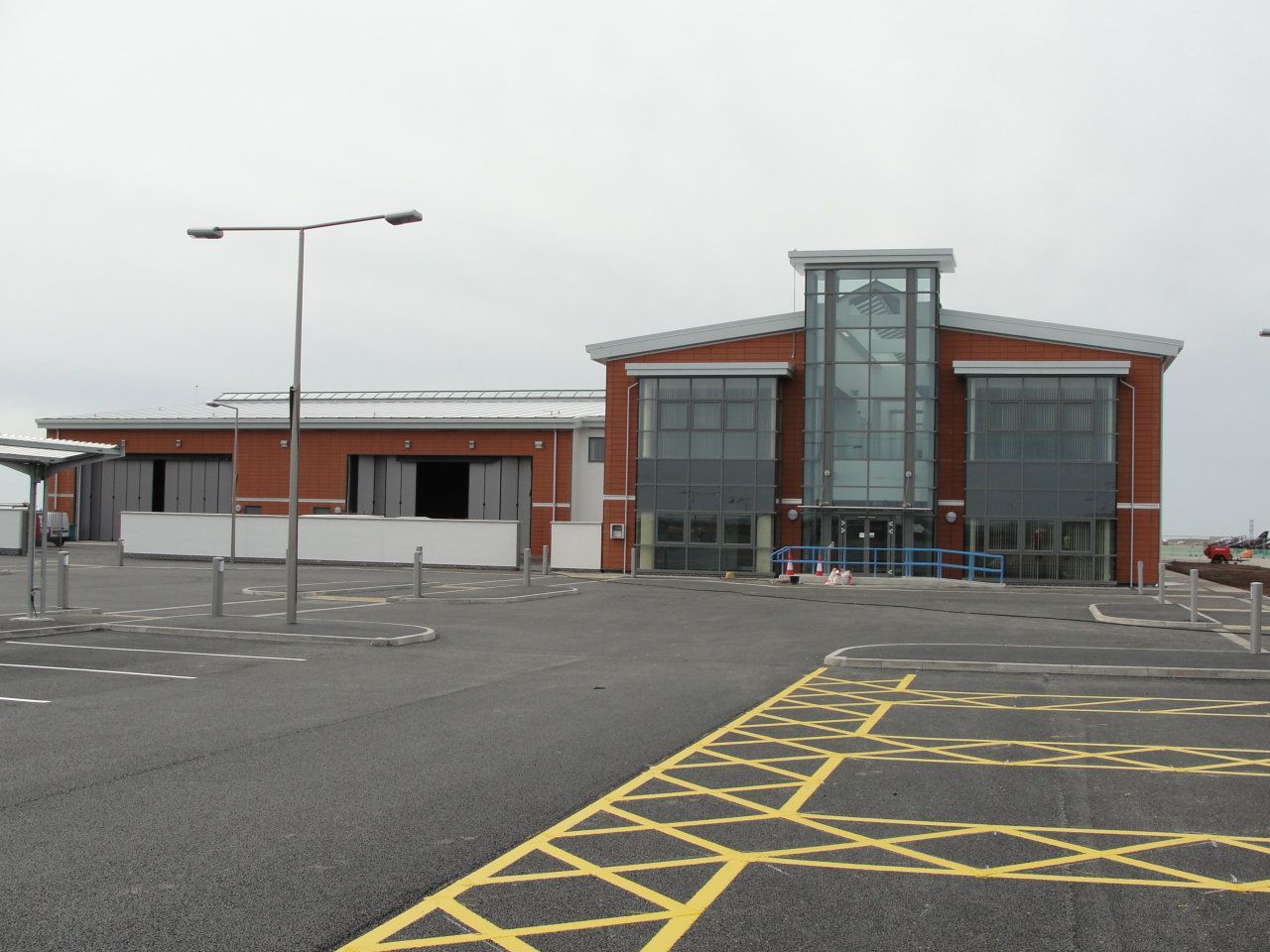 A large building with a parking lot in front of it