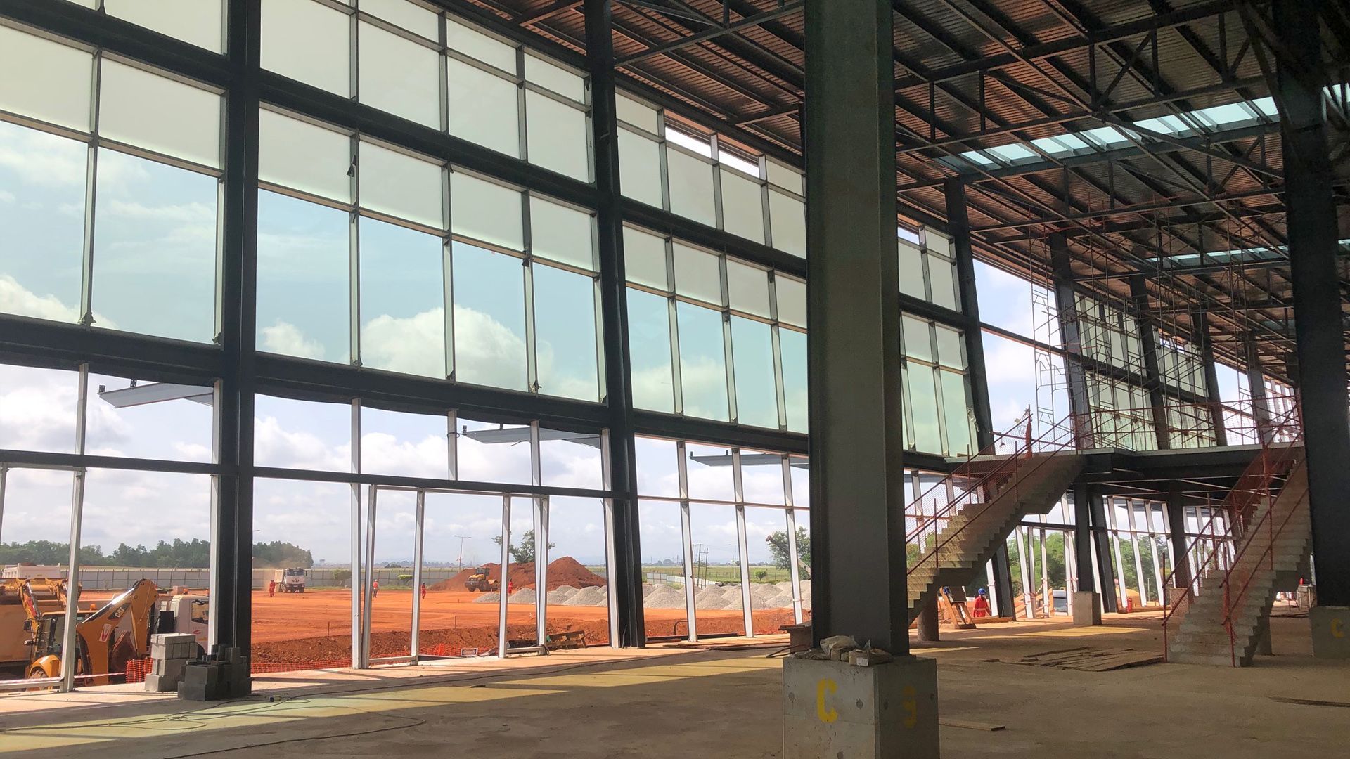 A large building under construction with a lot of windows.