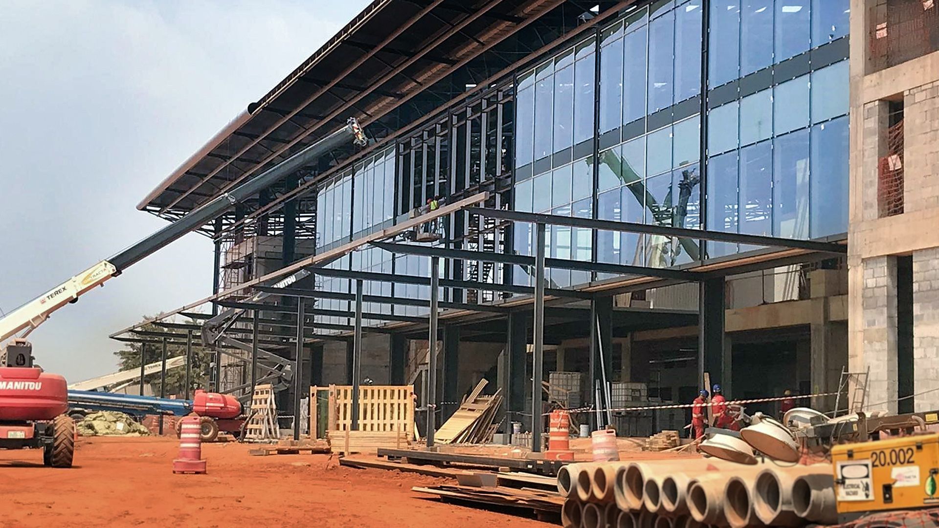 A large building is being built with a lot of windows.