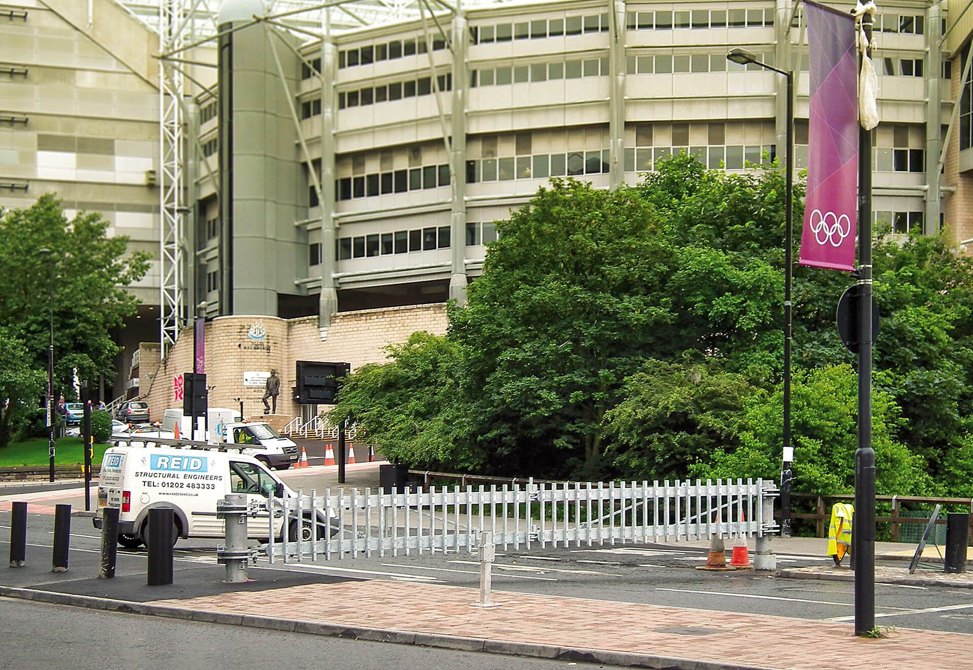 A building with a sign that says ' olympics ' on it