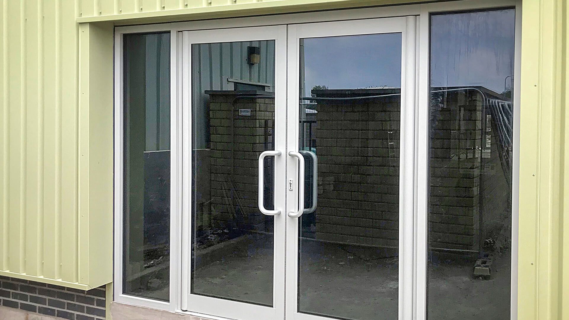 A pair of glass doors leading into a building.