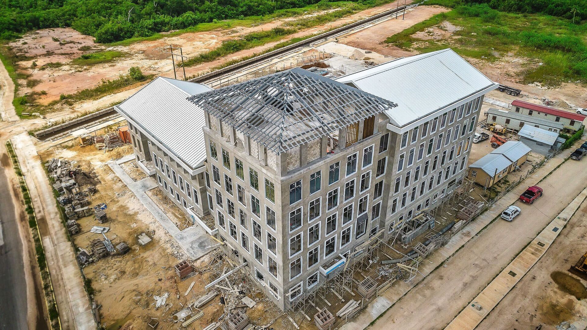 An aerial view of a large building under construction.