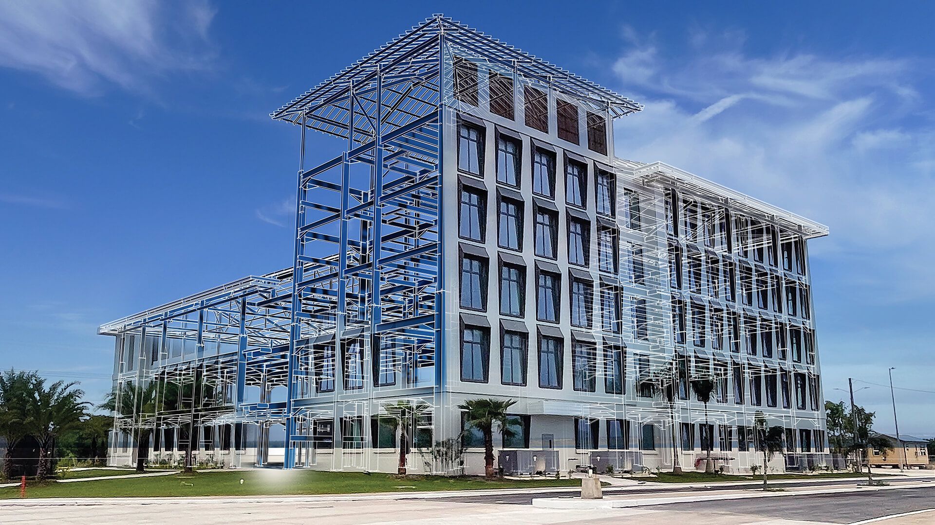 A large building with a lot of windows is under construction.