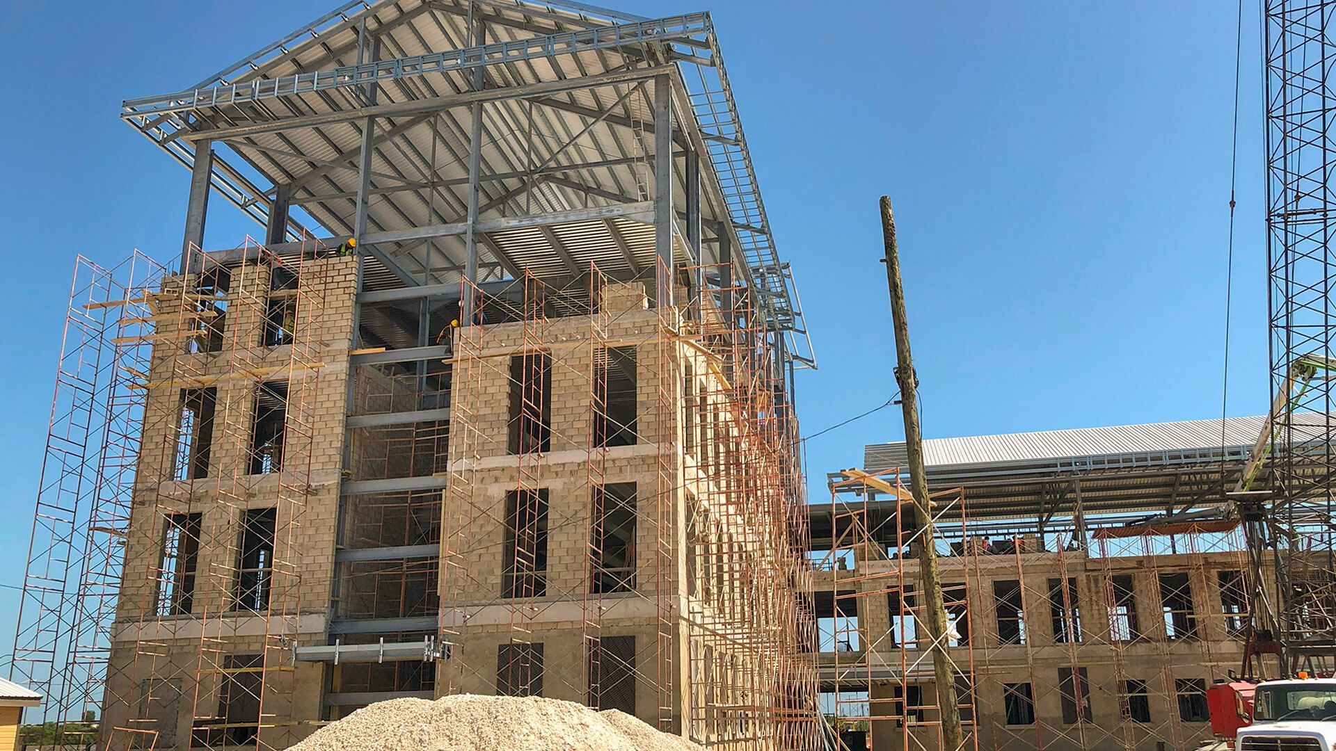 A large building under construction with scaffolding around it