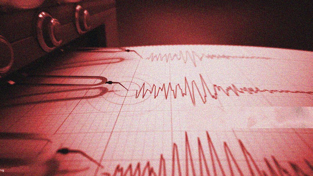 A close up of an earthquake record on a piece of paper.