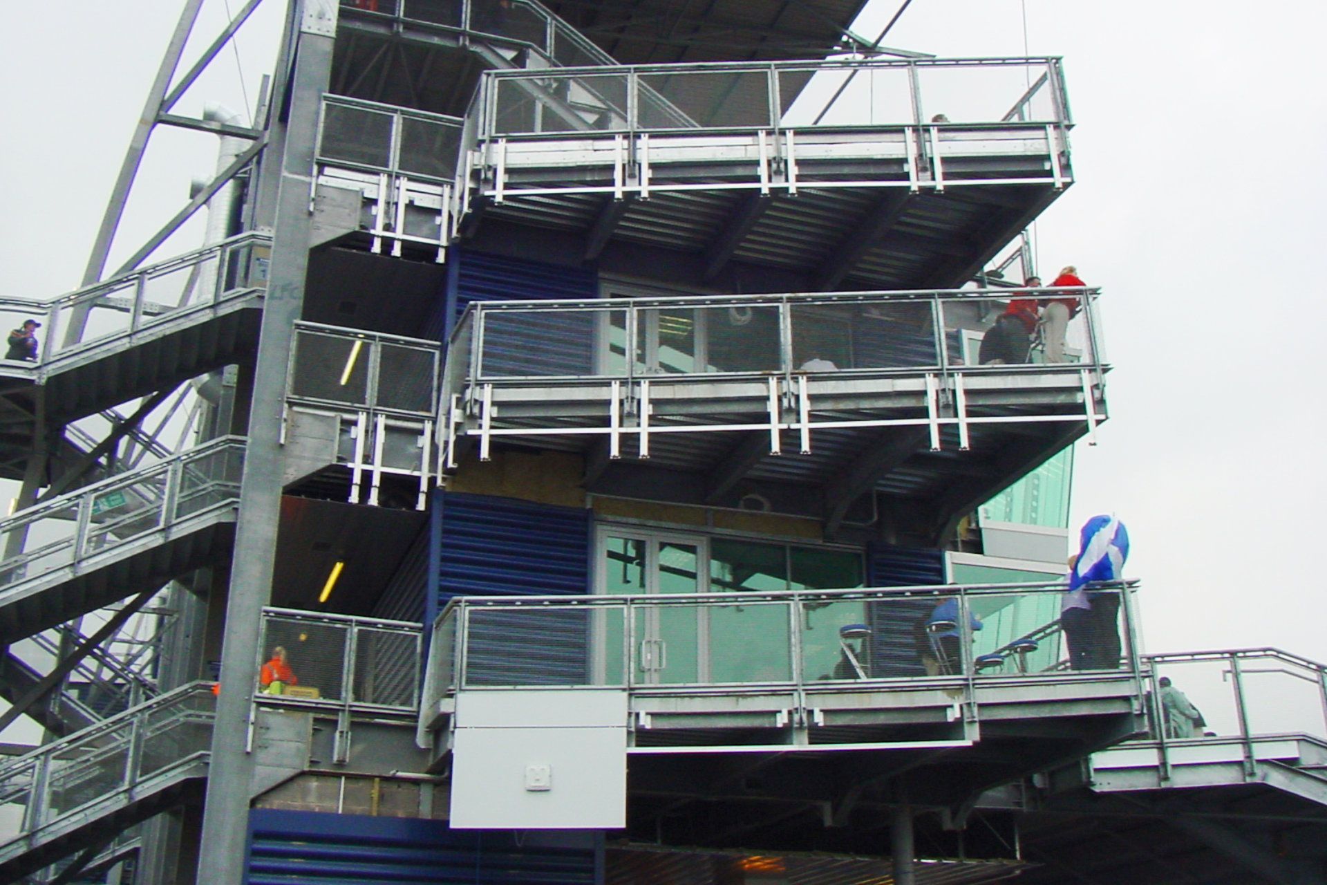 A very tall building with balconies and stairs