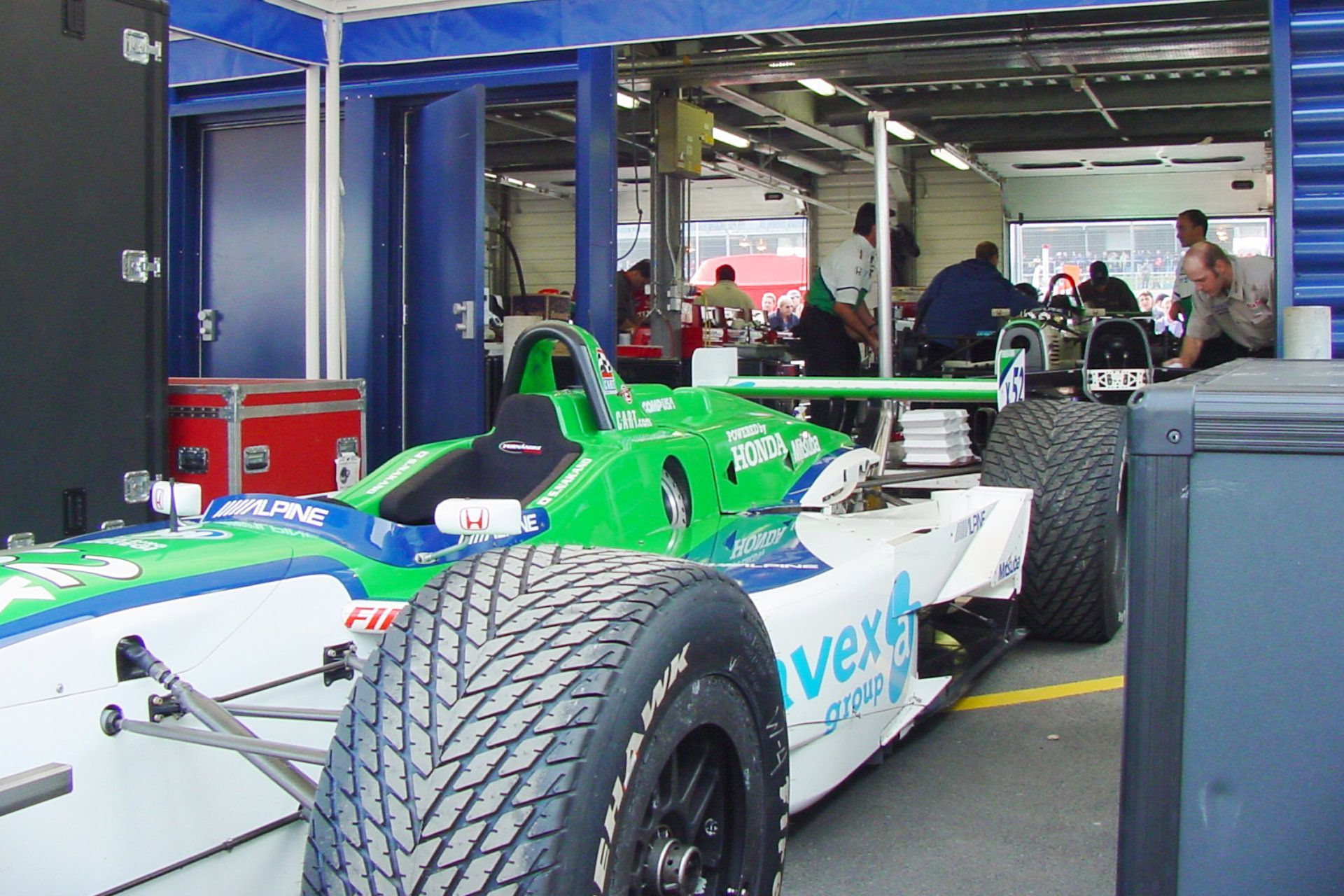 A green and white race car with the word very on the side