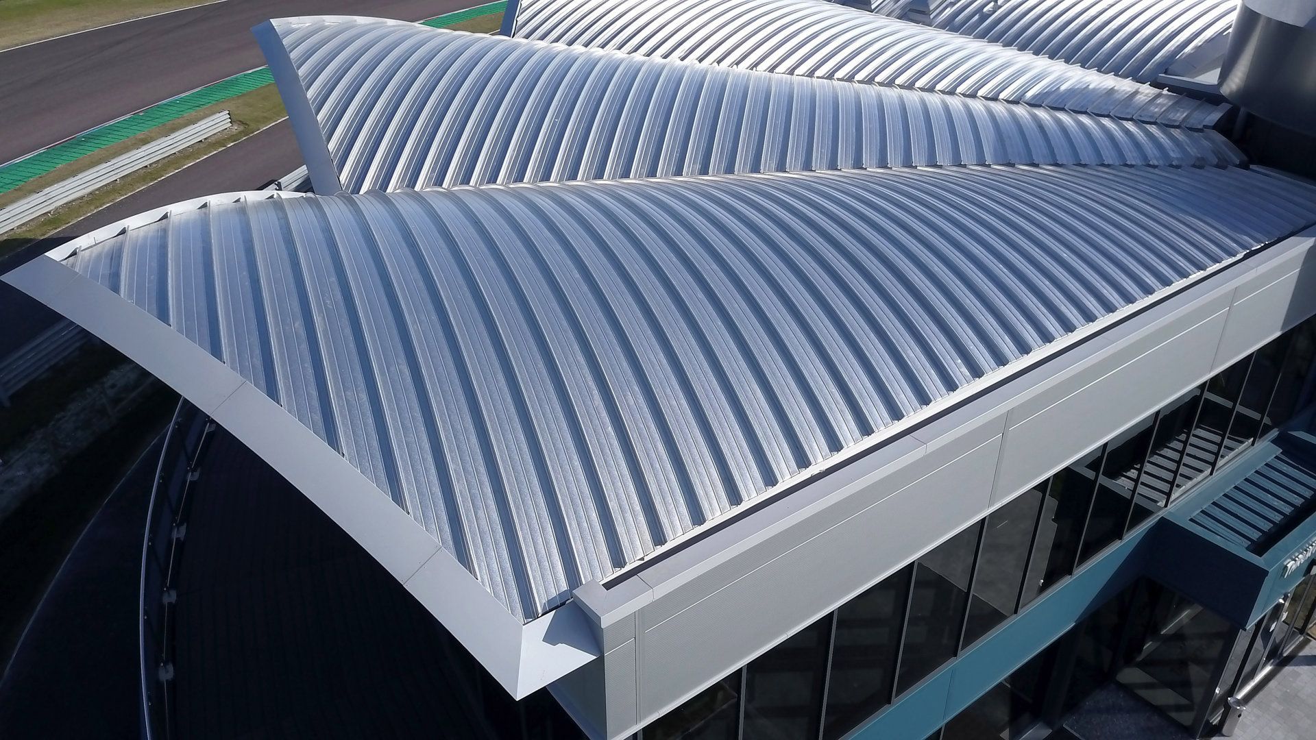 An aerial view of a building with a curved roof