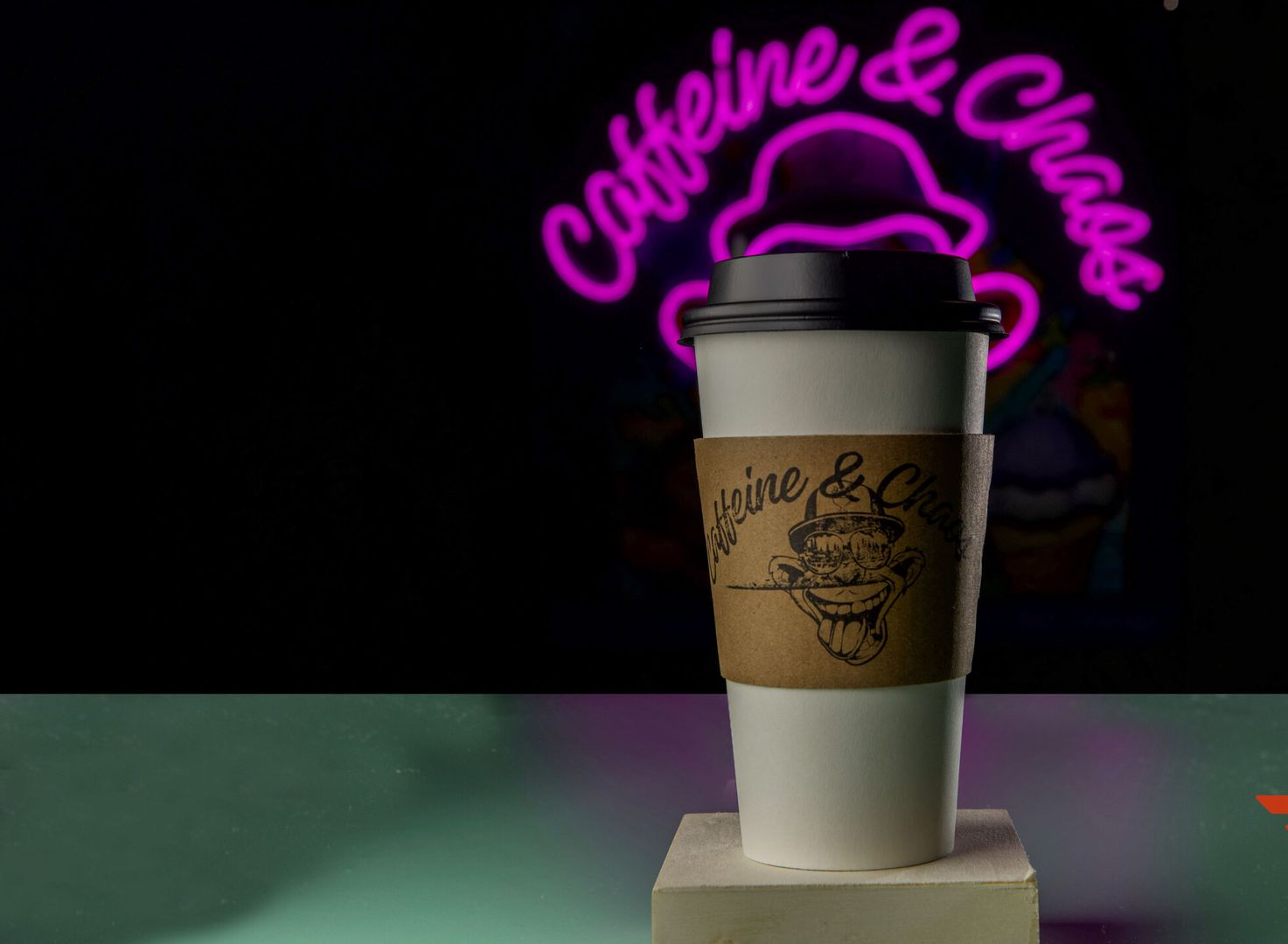 Coffee cup with a cardboard sleeve on a pedestal, 
