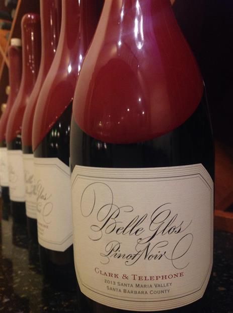 Bottles of Belle Glos Pinot Noir wine, red and black, in a row.