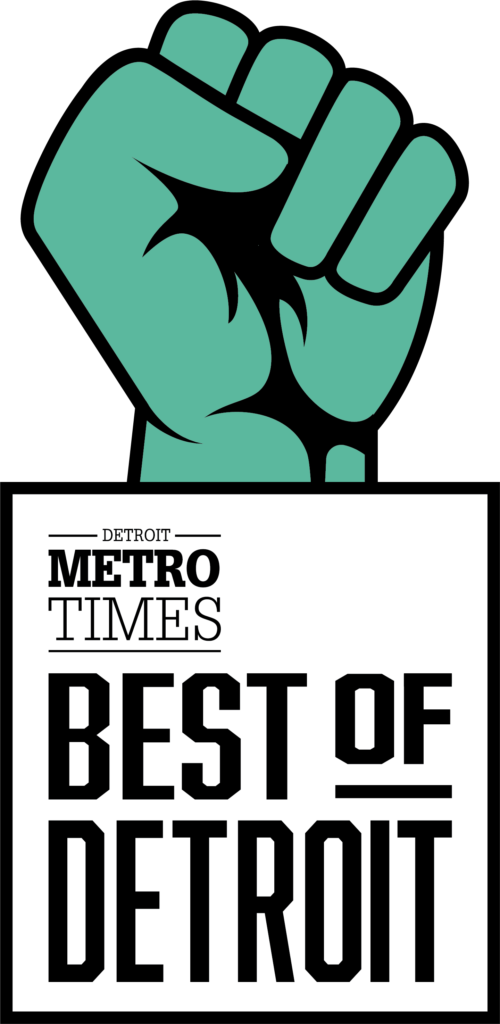 Green fist held high above a black and white 