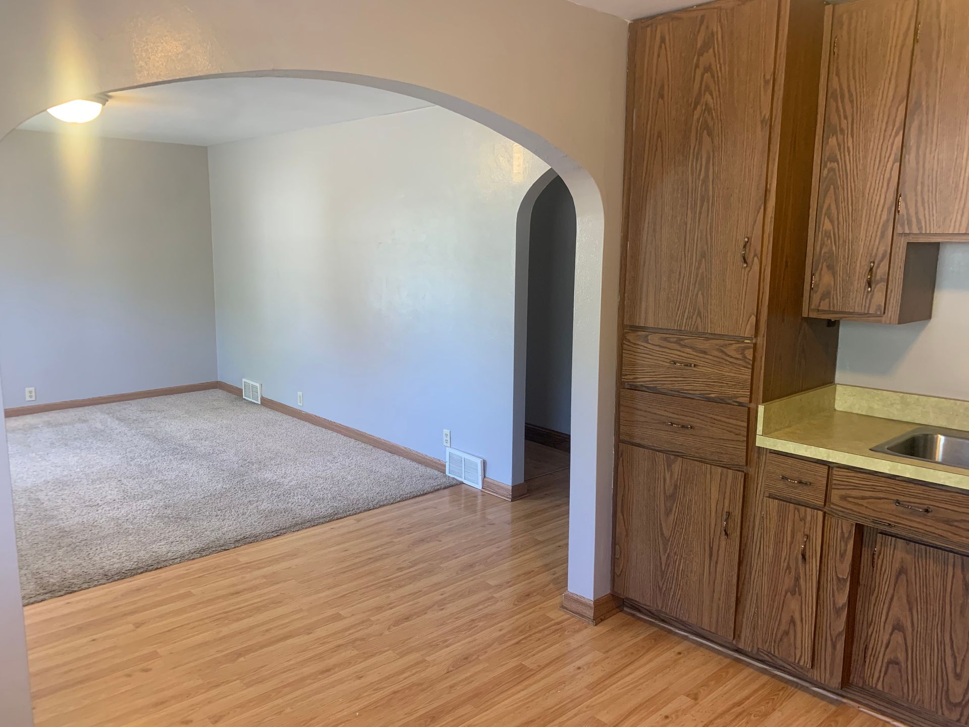 There is a kitchen and a living room in this house.