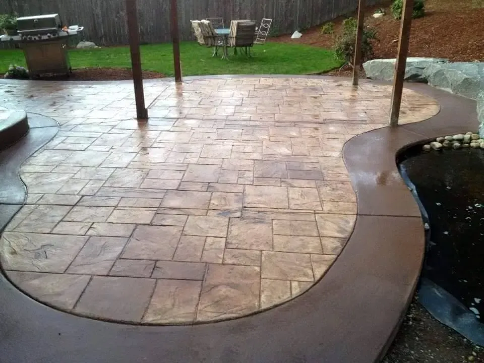 decorative concrete patio with dark stained border
