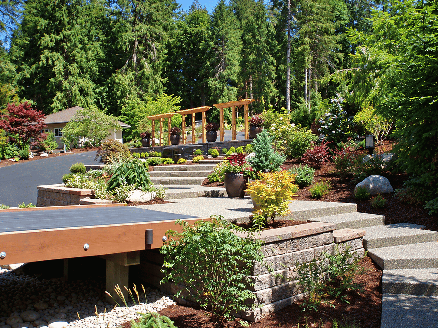 Completed stone patio and landscaping project by Dustin Concrete